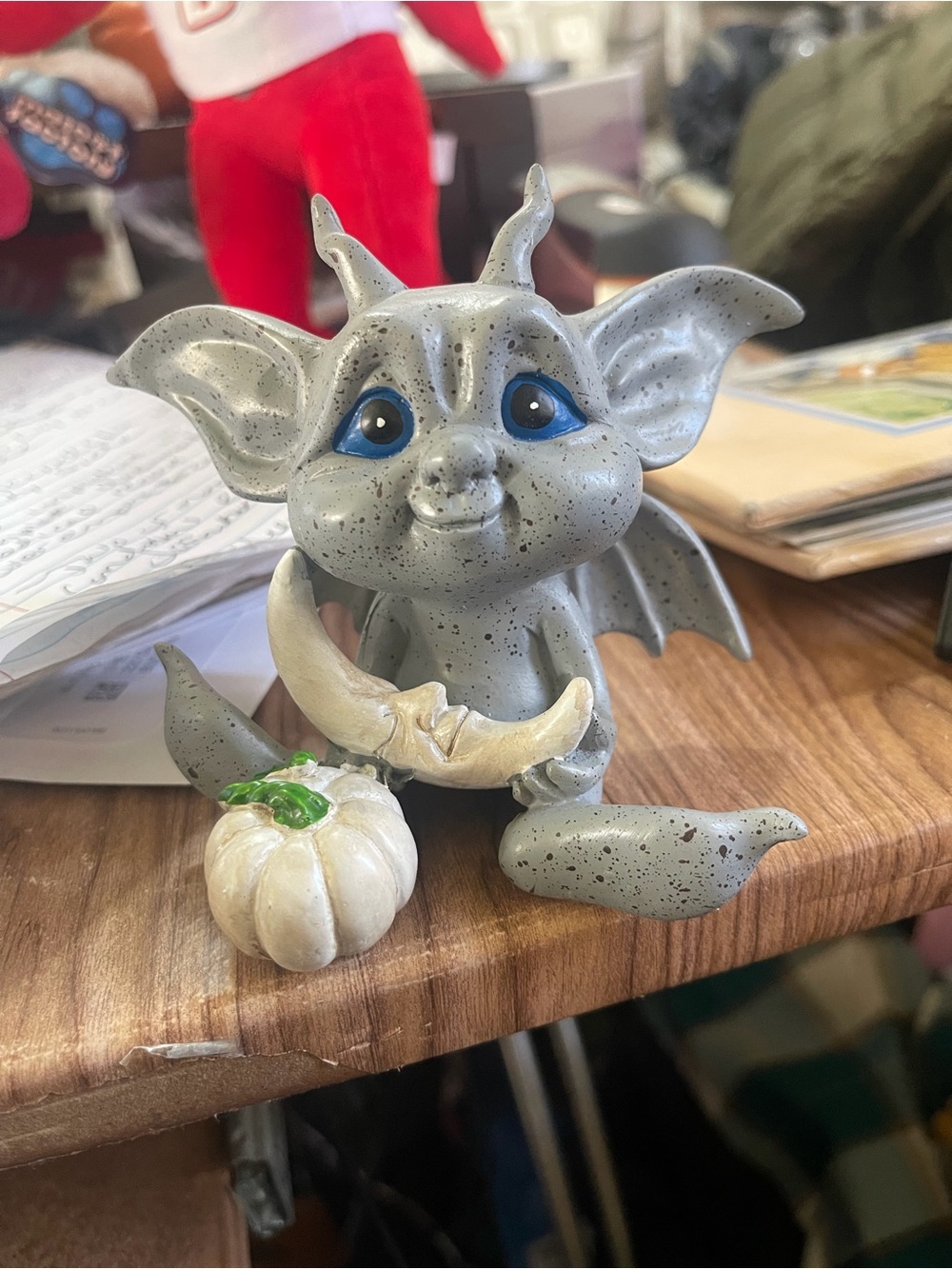 Cute majestic animal figurine with pumpkin and moon